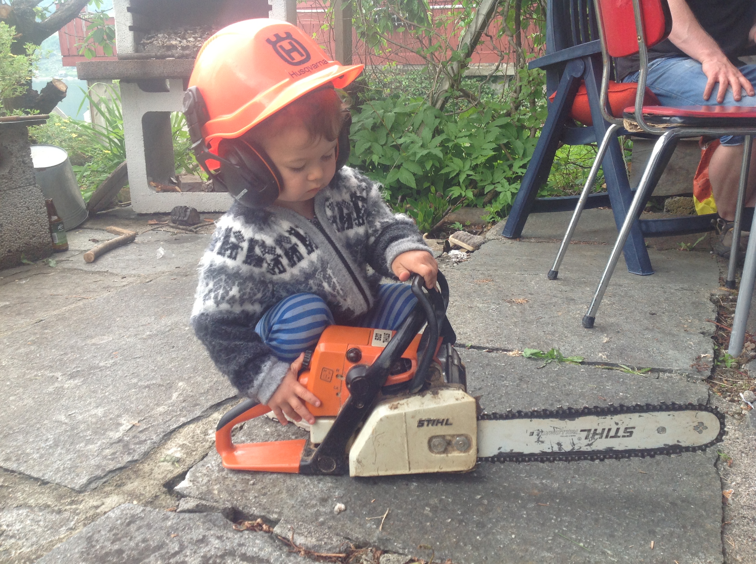 My son 2 years old with the chainsaw